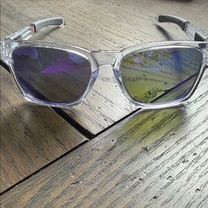 Oakley Transparent Frame Sunglasses with Purple Lenses